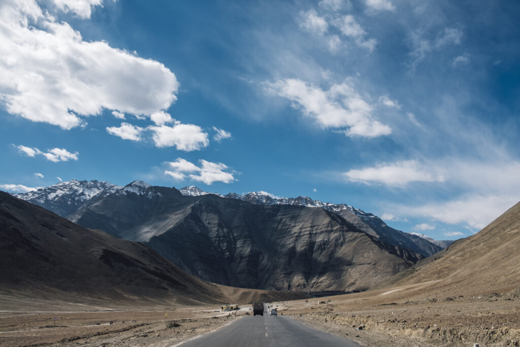 places to visit in India, best places to visit in India in June Valley of Flowers trek in June" and "Ladakh road trip scenery"